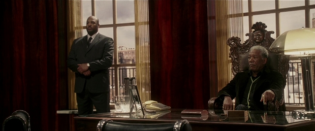 Wide shot frame from Lucky Number Slevin — sitting, standing, room