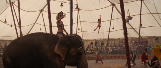 Wide shot frame from Water for Elephants — standing, hand, elephant