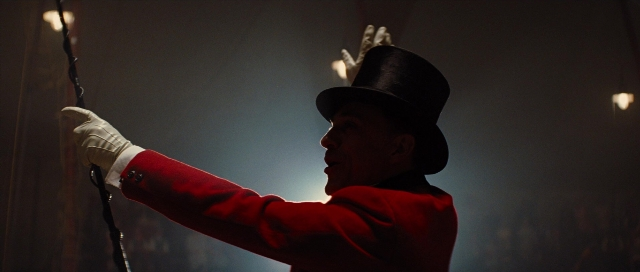 Wide shot frame from Water for Elephants — standing, hat, suit