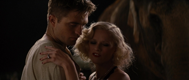 Medium shot frame from Water for Elephants — standing, shirt, face