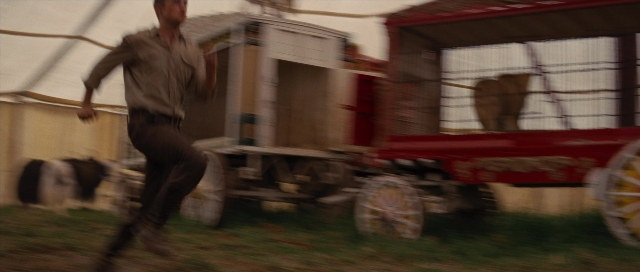 Wide shot frame from Water for Elephants — shirt, horse, wheel