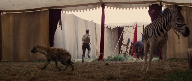 Wide shot frame from Water for Elephants — standing, walking, shirt