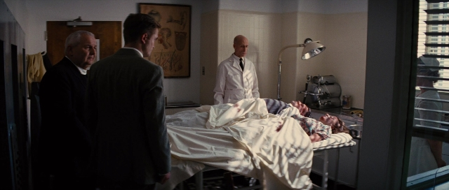 Wide shot frame from Water for Elephants — standing, room, bed