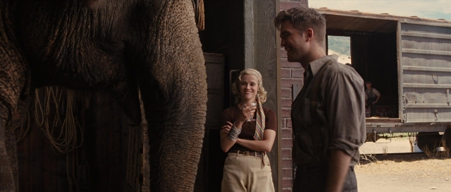 Wide shot frame from Water for Elephants — standing, shirt, person