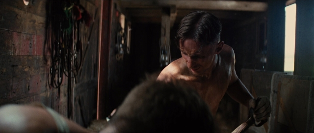Wide shot frame from Water for Elephants — room, hand, face