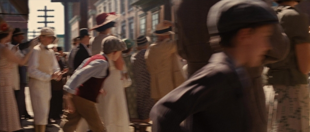 Medium shot frame from Water for Elephants — standing, walking, phone