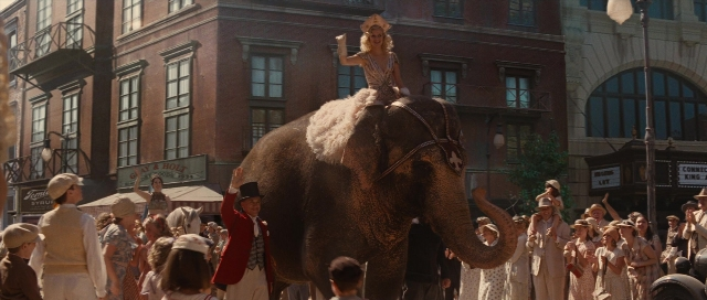 Wide shot frame from Water for Elephants — standing, street, hat