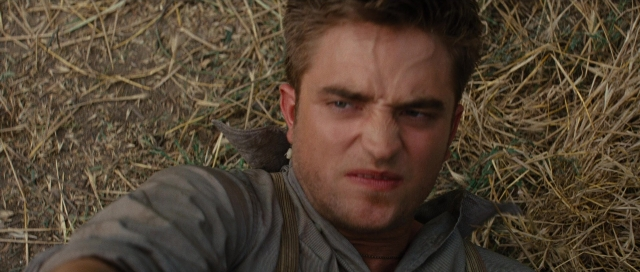 Close-up frame from Water for Elephants — bed, shirt, face