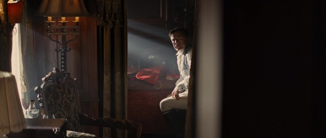 Wide shot frame from Water for Elephants — sitting, room, table