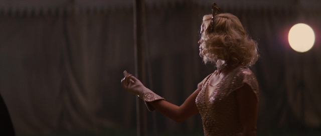 Wide shot frame from Water for Elephants — standing, dialogue, hand