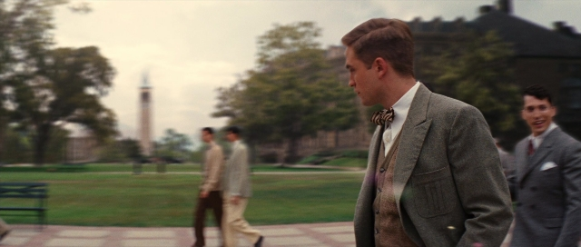 Wide shot frame from Water for Elephants — walking, suit, tie