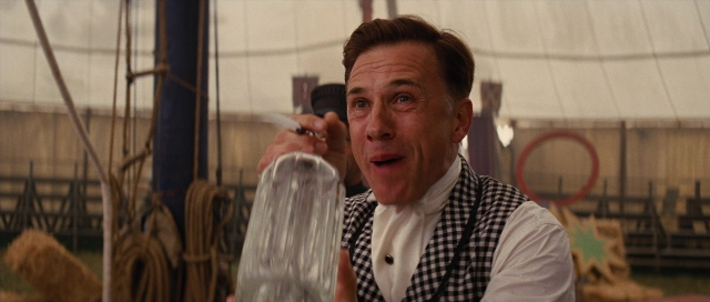 Wide shot frame from Water for Elephants — sitting, table, hand