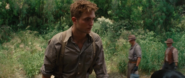 Wide shot frame from Water for Elephants — walking, dog, face