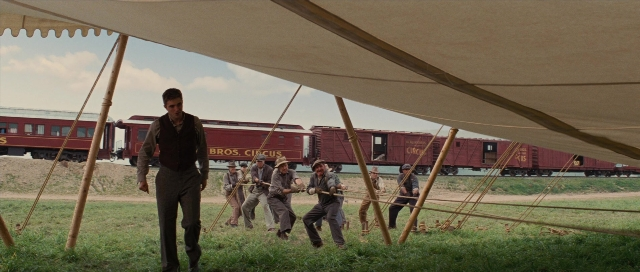 Wide shot frame from Water for Elephants — walking, train, person