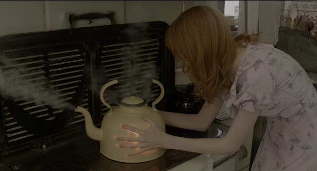 Wide shot frame from Miss Peregrine's Home for Peculiar Children — standing, hair, kettle