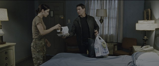 Wide shot frame from Jack Reacher: Never Go Back — standing, room, bed