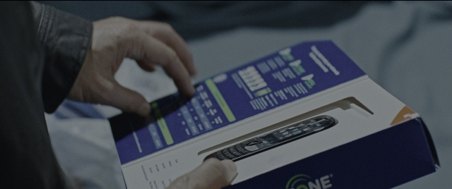 Wide shot frame from Jack Reacher: Never Go Back — sitting, bed, hand