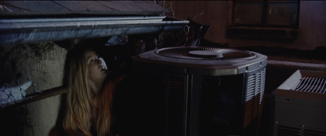 Wide shot frame from Jack Reacher: Never Go Back — standing, face, hair