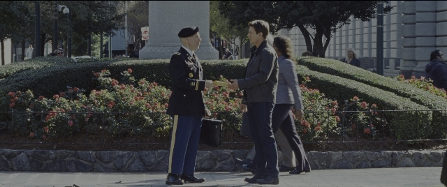 Wide shot frame from Jack Reacher: Never Go Back — standing, walking, bed