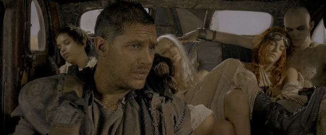 Wide shot frame from Mad Max: Fury Road — people, action, group