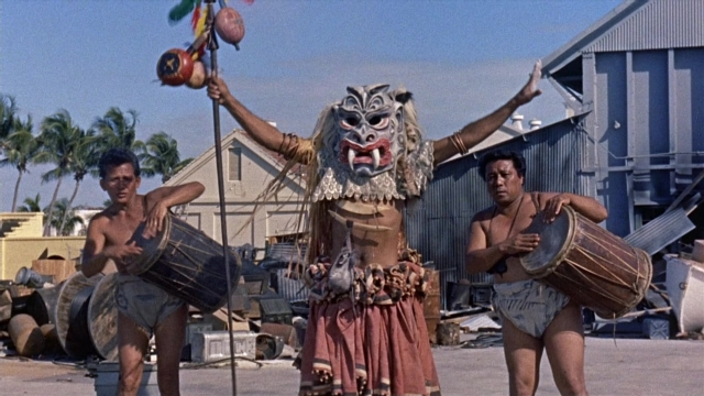 Wide shot frame from Operation Petticoat — standing, face, drum