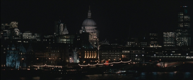 Frame from RocknRolla — night, water, tower