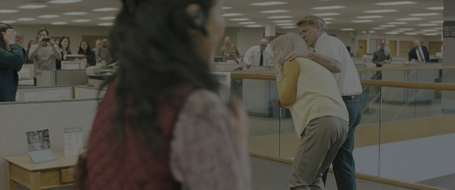Wide shot frame from Everything Everywhere All at Once — standing, table, shirt