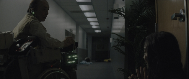 Wide shot frame from Everything Everywhere All at Once — phone, door, shirt