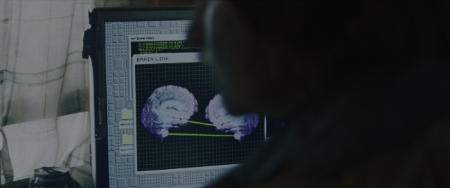 Wide shot frame from Everything Everywhere All at Once — sitting, face, hair