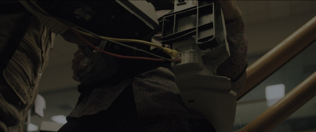 Wide shot frame from Everything Everywhere All at Once — standing, room, person