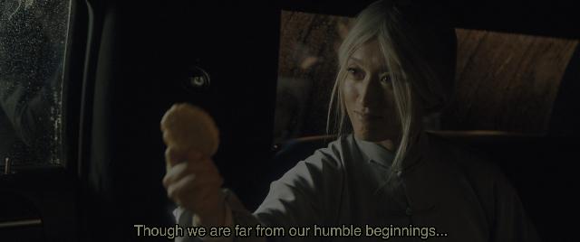 Wide shot frame from Everything Everywhere All at Once — sitting, room, car