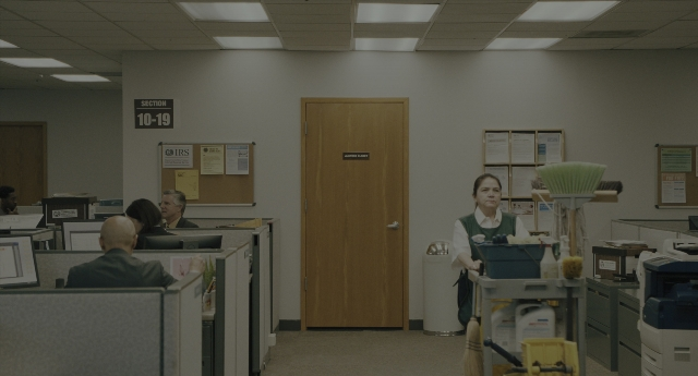 Wide shot frame from Everything Everywhere All at Once — sitting, standing, room
