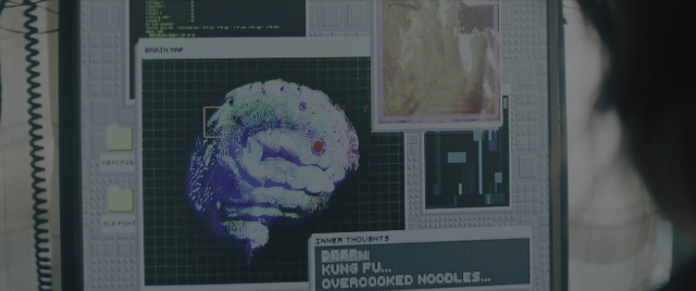 Wide shot frame from Everything Everywhere All at Once — room, poster, human face