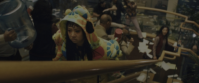 Wide shot frame from Everything Everywhere All at Once — standing, hat, face