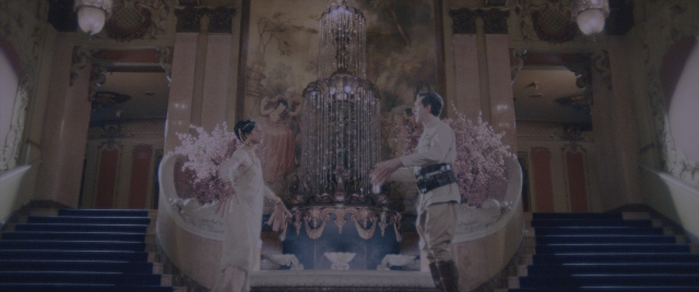 Wide shot frame from Everything Everywhere All at Once — standing, room, dialogue