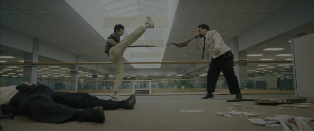 Frame from Everything Everywhere All at Once — standing, hand, shirt