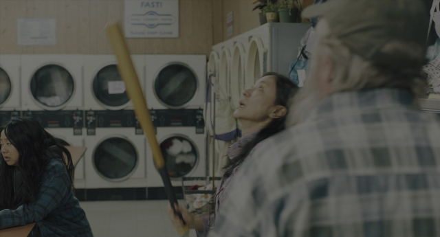 Wide shot frame from Everything Everywhere All at Once — room, hat, shirt