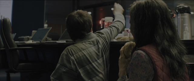 Wide shot frame from Everything Everywhere All at Once — sitting, plate, hand