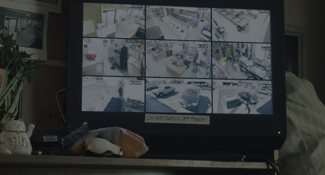 Wide shot frame from Everything Everywhere All at Once — street, television, furniture