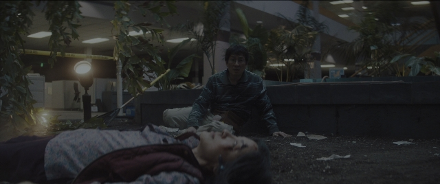 Wide shot frame from Everything Everywhere All at Once — sitting, room, lamp