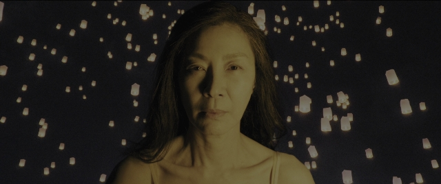 Wide shot frame from Everything Everywhere All at Once — face, hair, person