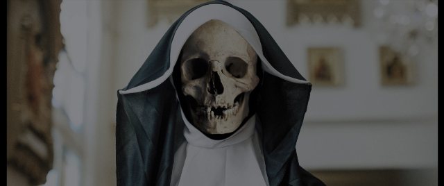 Medium shot frame from Everything Everywhere All at Once — standing, room, skull