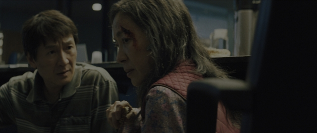 Wide shot frame from Everything Everywhere All at Once — sitting, room, kitchen