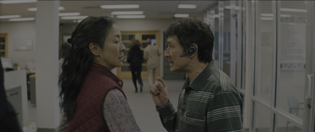 Wide shot frame from Everything Everywhere All at Once — standing, walking, dialogue