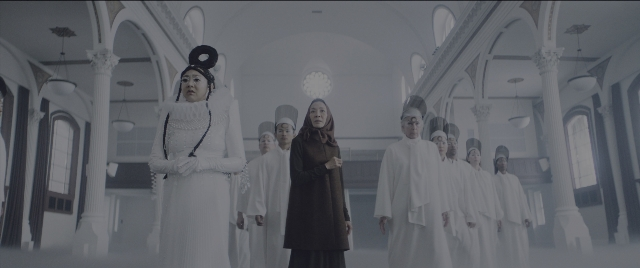 Wide shot frame from Everything Everywhere All at Once — standing, room, clock