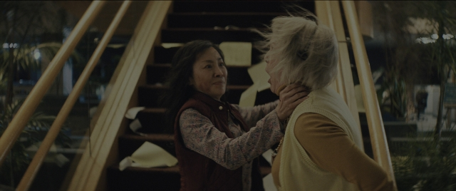 Frame from Everything Everywhere All at Once — standing, room, dialogue
