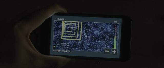 Wide shot frame from Everything Everywhere All at Once — phone, hand, person