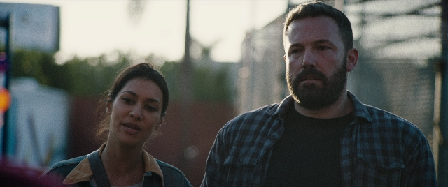 Wide shot frame from The Way Back — standing, face, hair