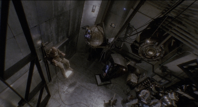 Wide shot frame from Twelve Monkeys — standing, room, bird