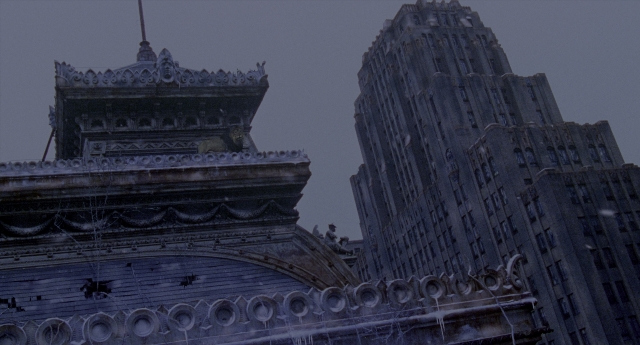 Wide shot frame from Twelve Monkeys — tower, snow